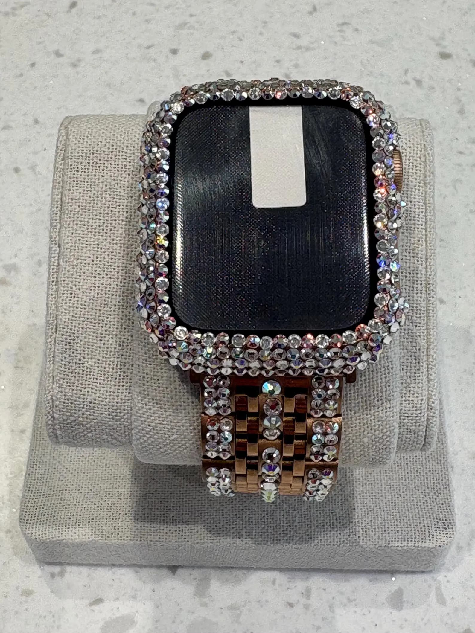 Luxury Watch Screen Case with Preciosa® Crystals on a beige display, featuring a crystal-encrusted bezel and band.
