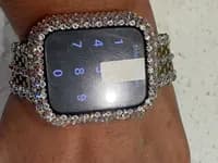 Luxury Watch Screen Case with Preciosa® Crystals, showing a locked smart watch face, and a crystal-encrusted bezel and band.