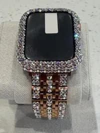 Luxury Watch Screen Case with Preciosa® Crystals, featuring a rose gold band and crystal-covered bezel, displayed on a cushion.