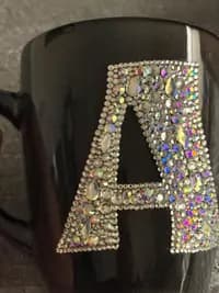 Personalized Crystal Initial Mug featuring the letter "A" in sparkling crystals on a black ceramic surface.