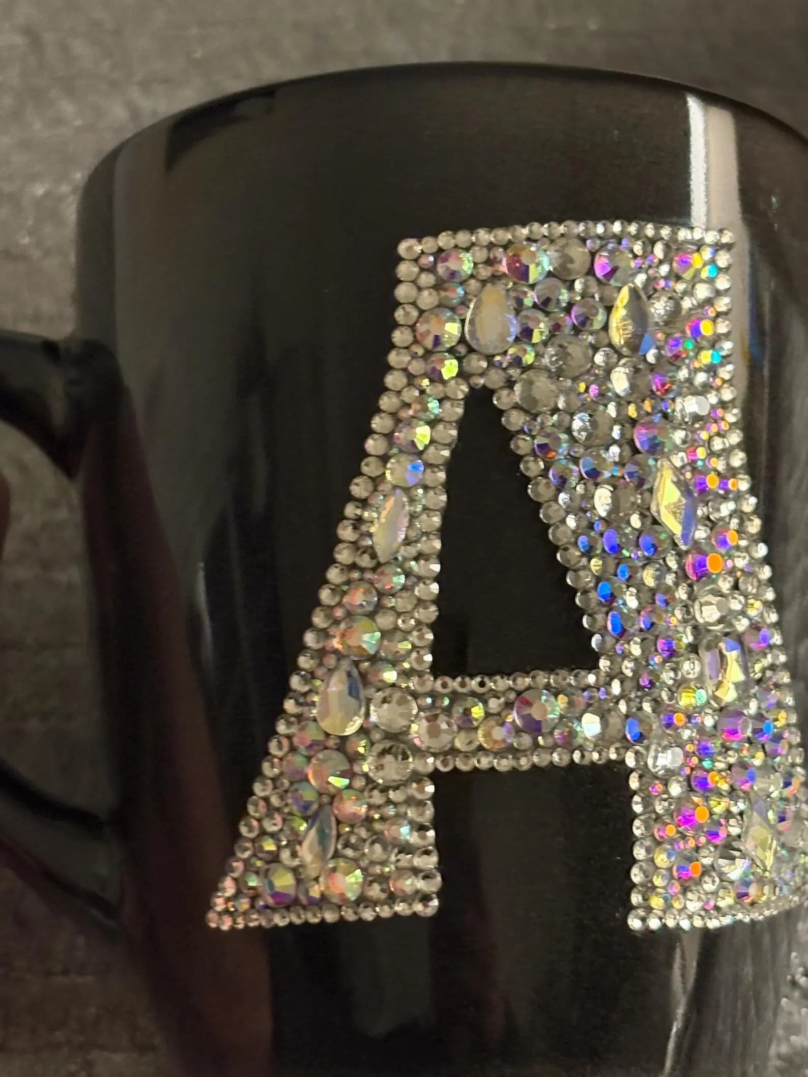Personalized Crystal Initial Mug featuring the letter "A" in sparkling crystals on a black ceramic surface.
