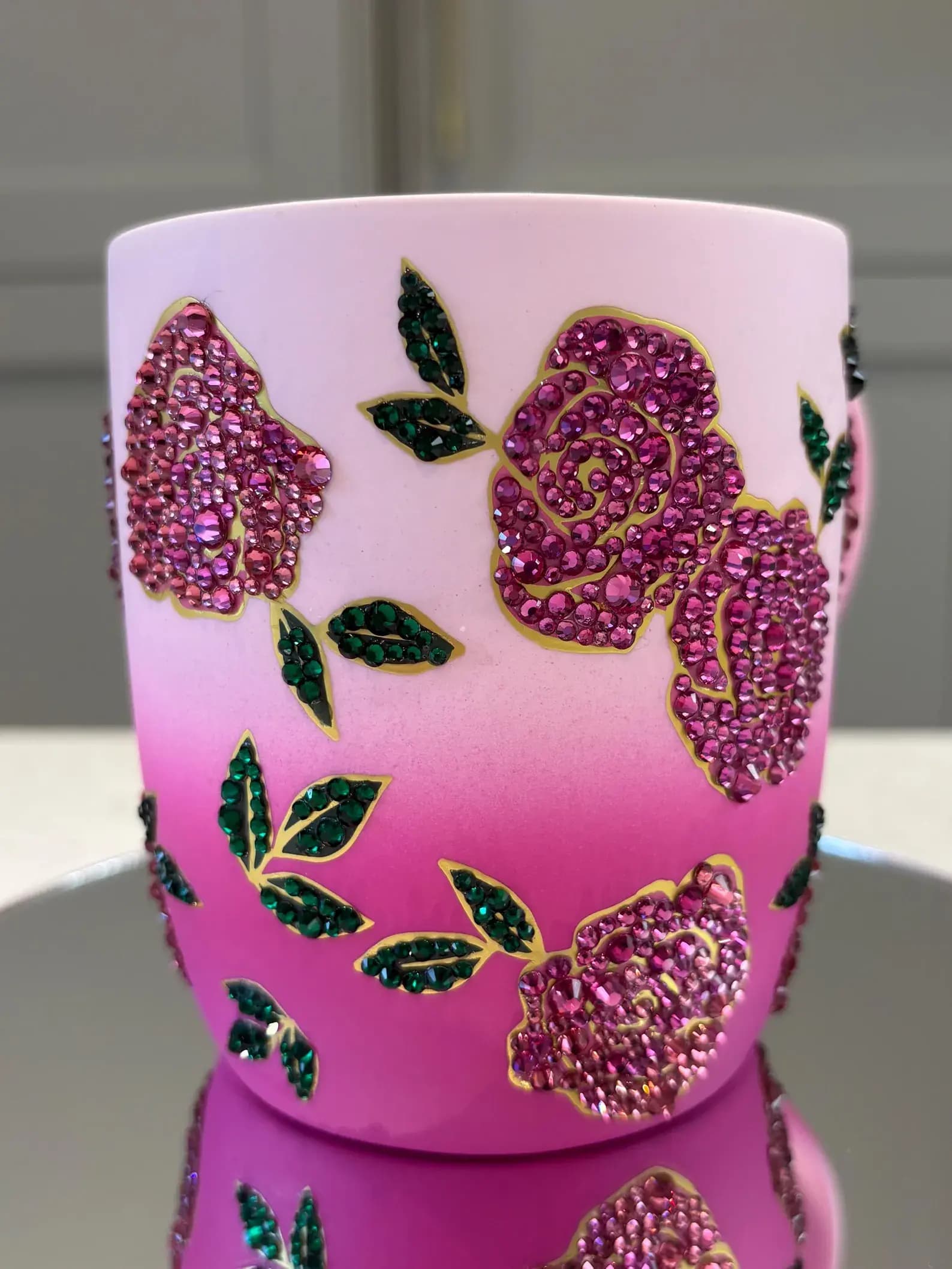 Sparkling Crystal Flower Mug with pink gradient, adorned with pink crystal roses and green leaves, shown from the front.
