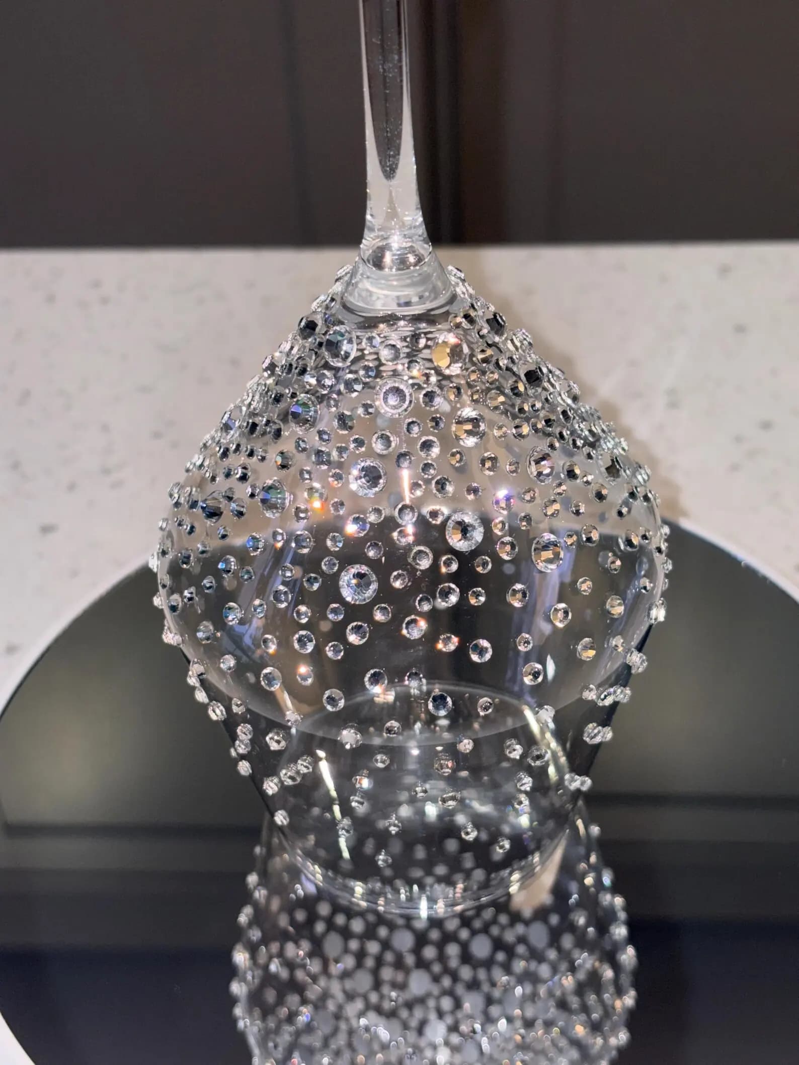 Luxury Crystal White Wine Glass with sparkling crystals, shown upside down highlighting the intricate graduated design detail.